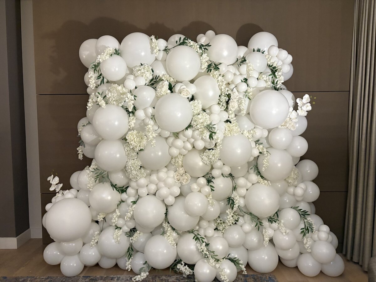 white balloon wall with florals PNW
