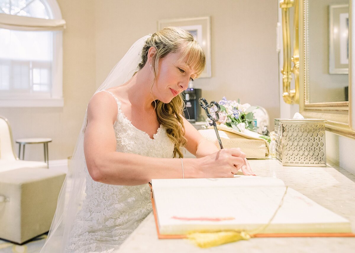 Bride writes vows at Disney's Wedding Pavilion