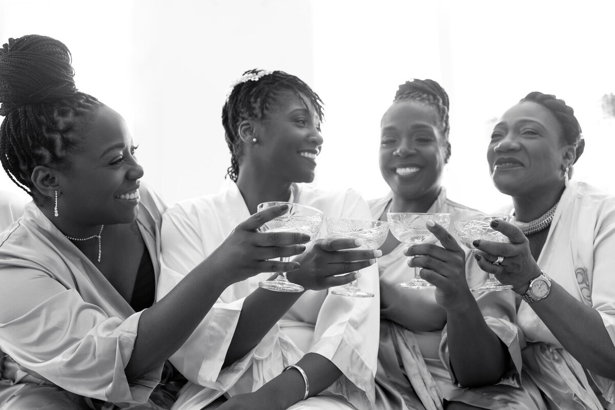 Black and white photo of the bride tribe holding their drinks