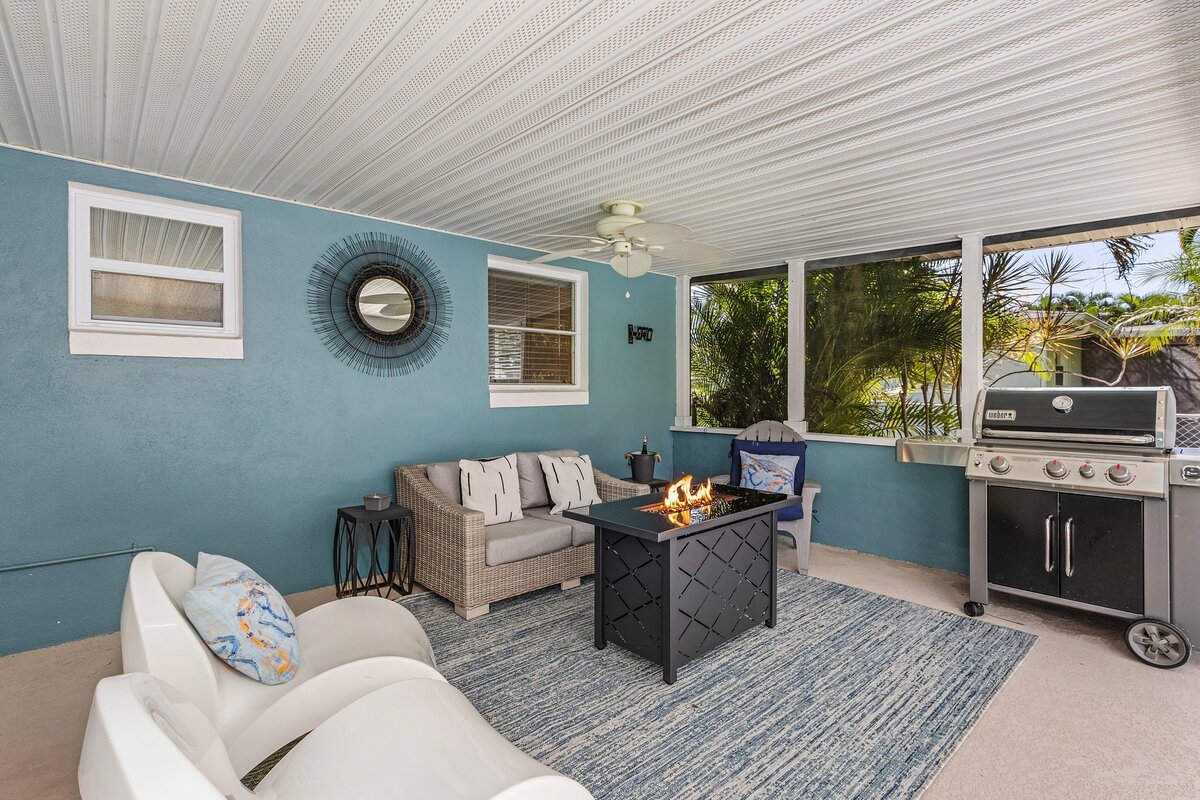 Patio space with blue accents and grill