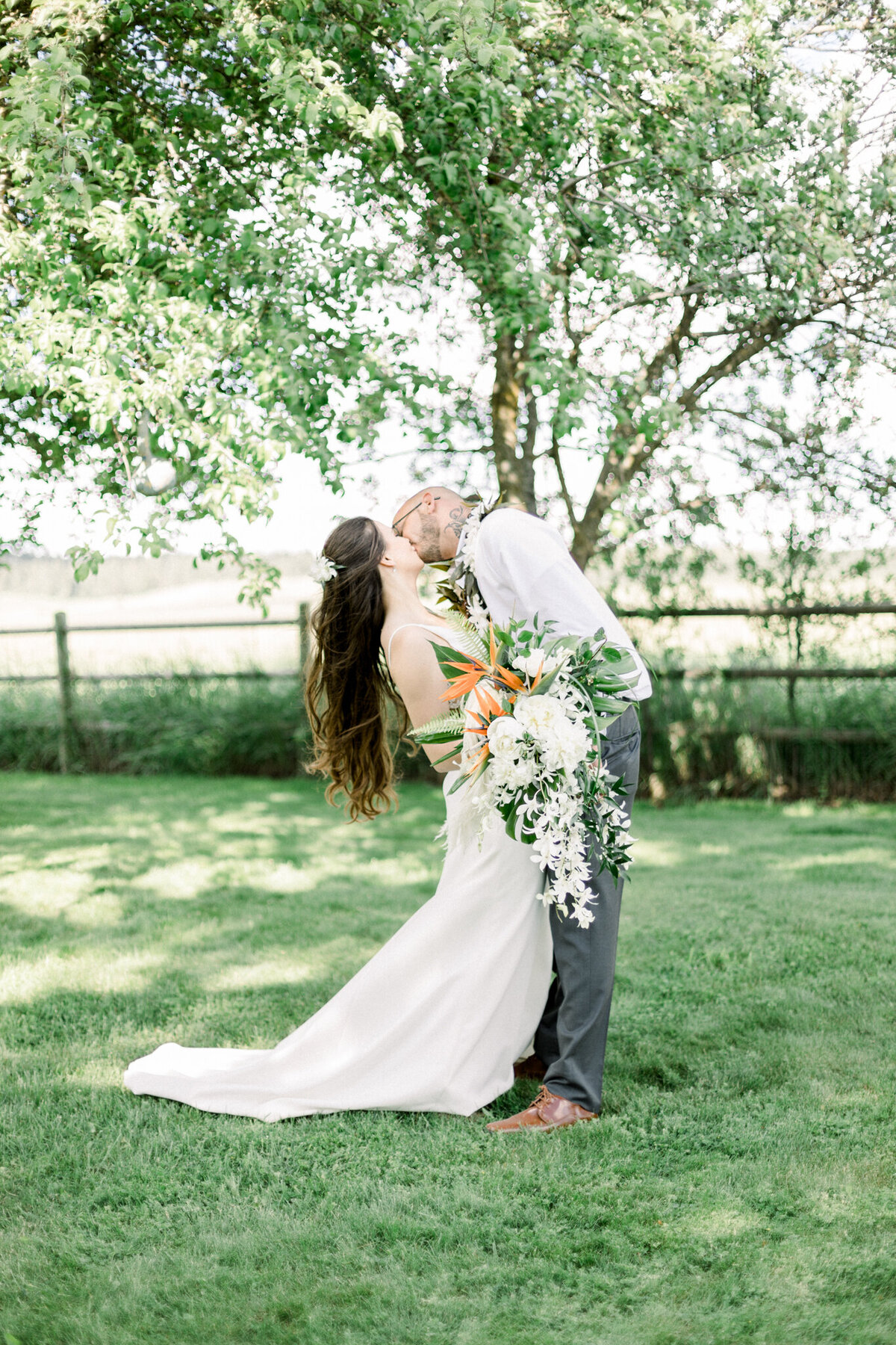 Bride and groom sharing a kiss on their wedding day taken by spokane wedding photographer