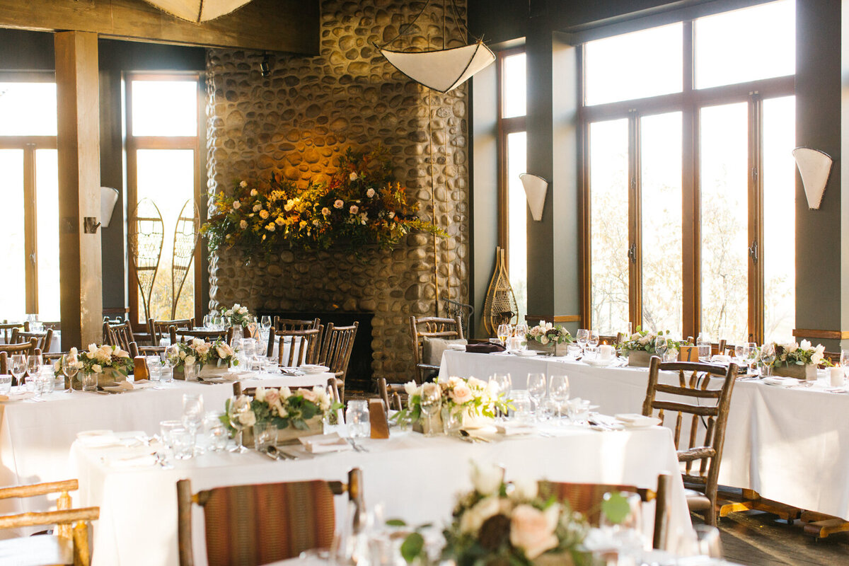 Beautiful and elegant indoor reception at River Cafe, a riverside wedding venue in downtown Calgary, featured on the Brontë Bride Vendor Guide.