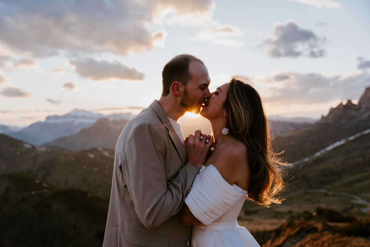 romantic couple kissing during twilight elopement in Dolomites