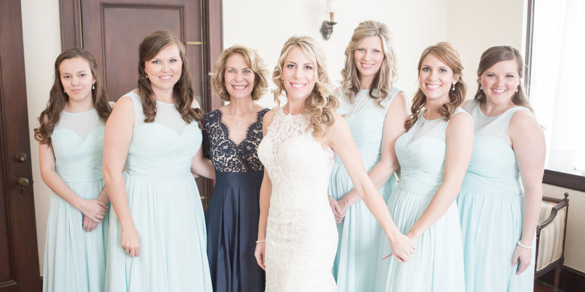The bride and her bridesmaids pose for a photo before leaving for the church in Mobile, Alabama.