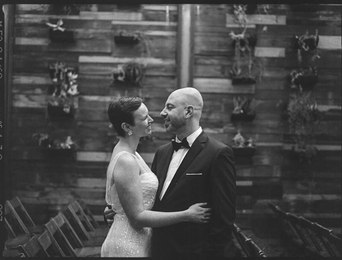 Black and white photo of a couple hugging.