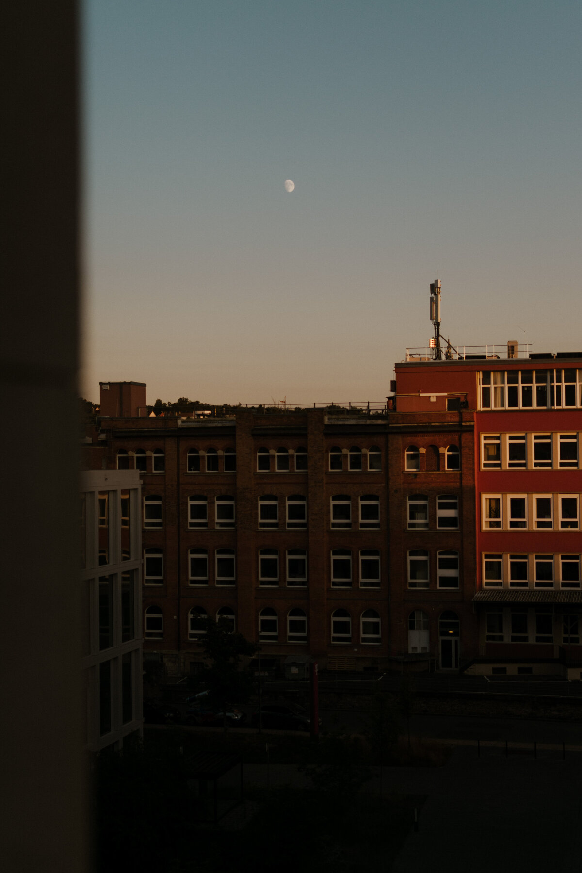 Skyline of Germany with the moon in the sky.