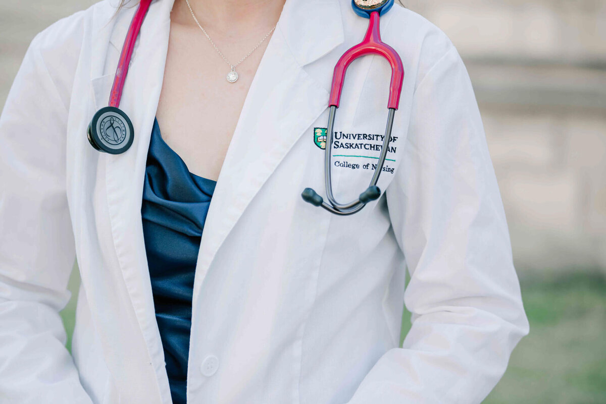 A close up of a white nursing coat