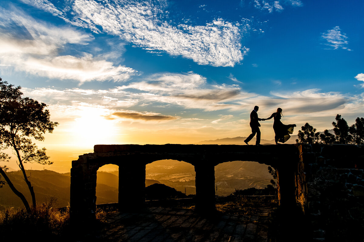 Bride and Groom walk high in the sky before a unreal sunset taken just before dusk in beautiful Santa Barbara, photo by Tanya Parada 