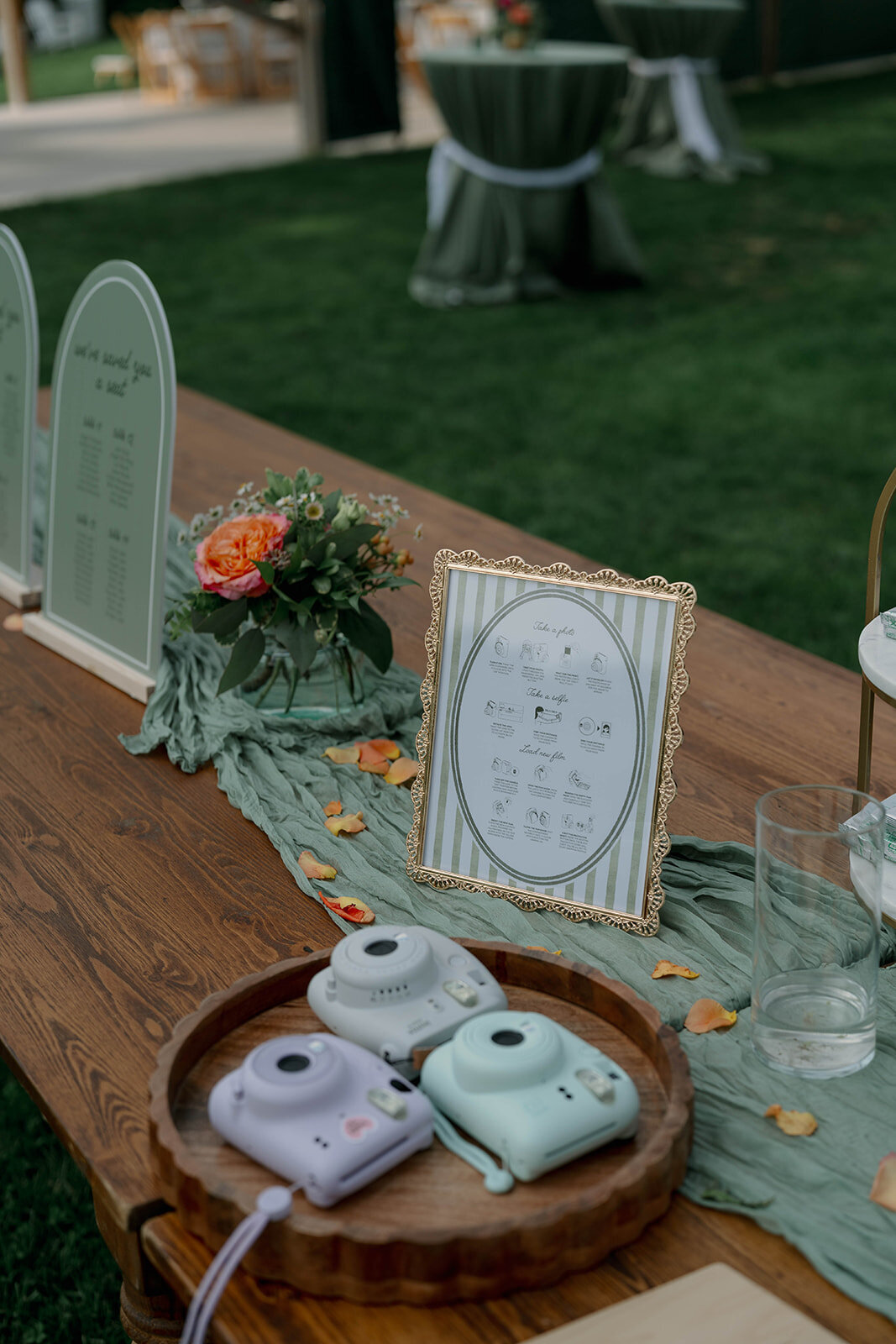 Close-up wedding detail photo of the gift table signage and guest book setup at a fall orchard wedding in Frankfort MI.