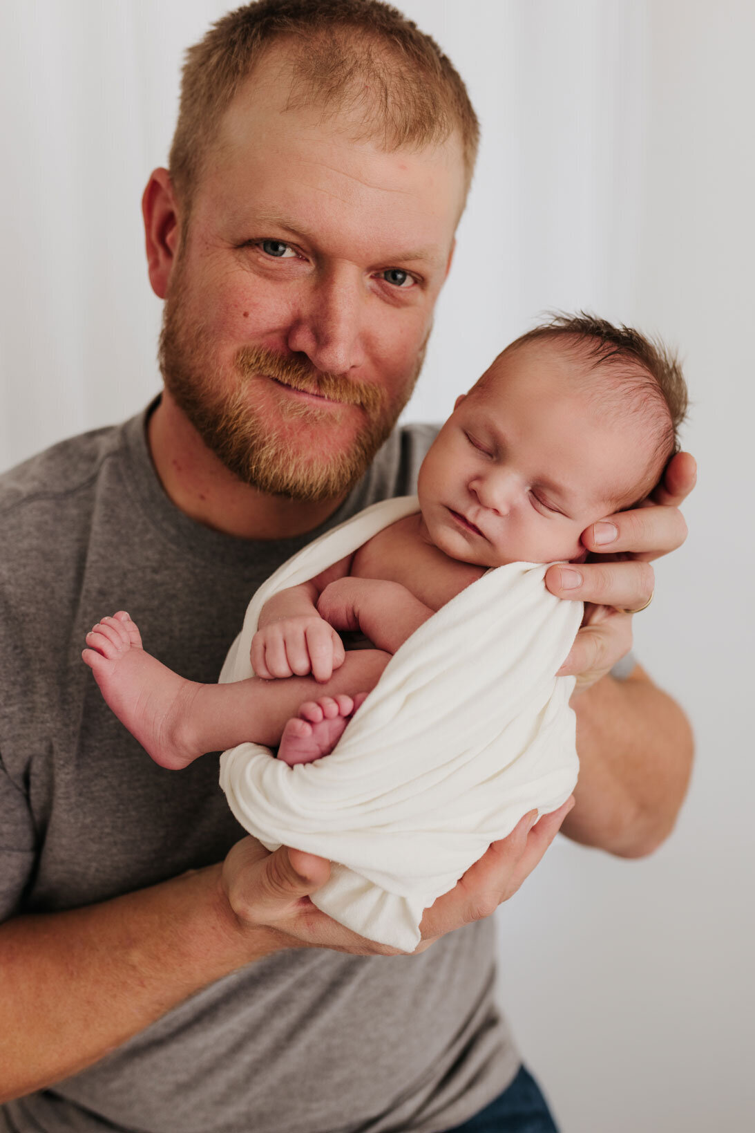 father-and-newborn-baby-in-studio