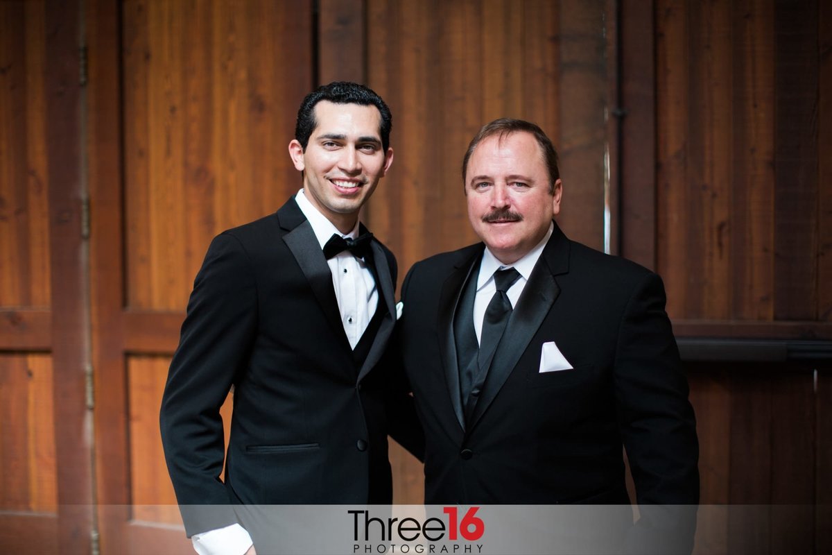 Groom posing with the Father of the Bride