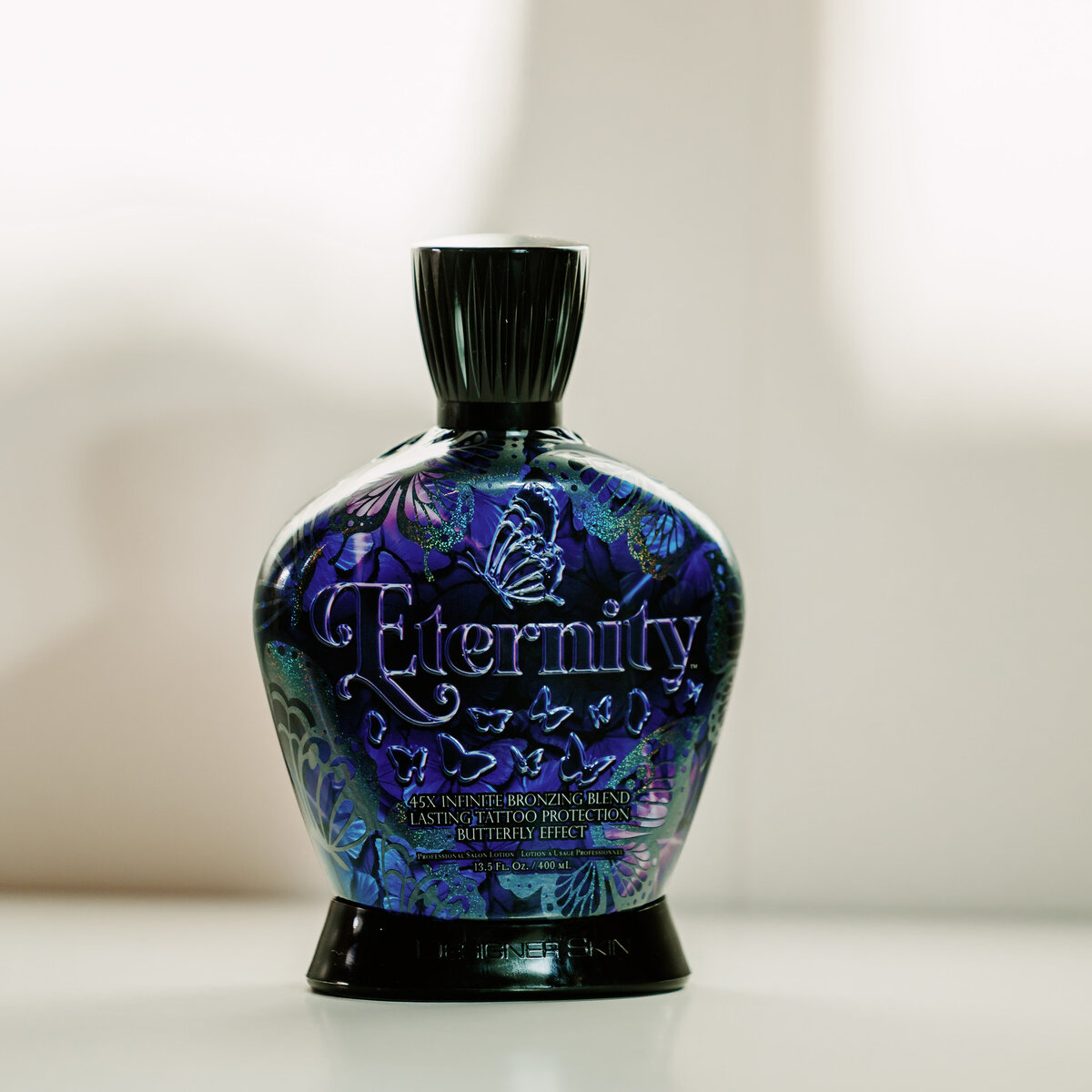 A blue perfume bottle sitting on a shelf