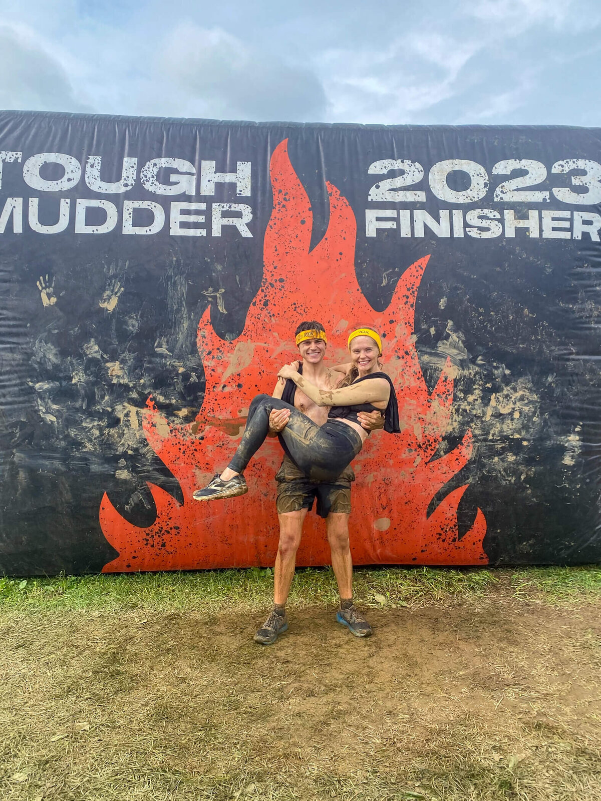 Michael and Deidra hold onto each other in celebration after completing the Pittsburgh Tough Mudder