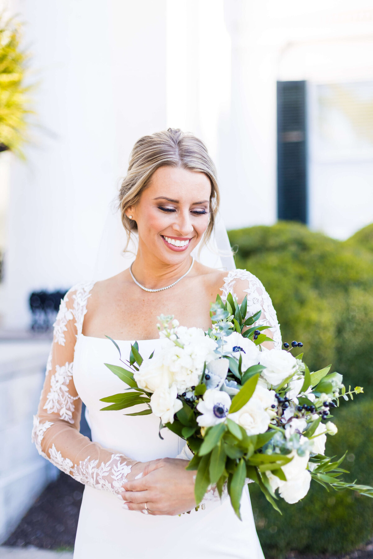 Bride carrying bouquet of florals