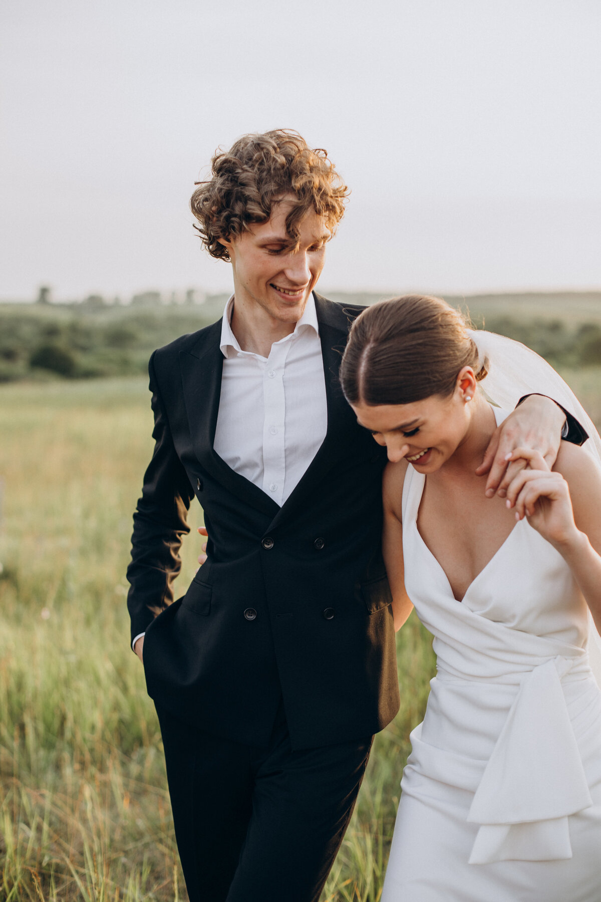 young-wedding-couple-together-field