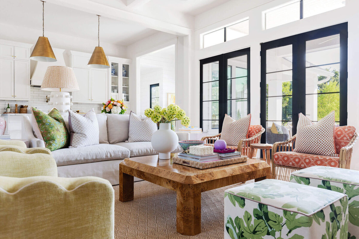 oyster creek studios aryns home colorful seating around a wooden coffee table in living room 