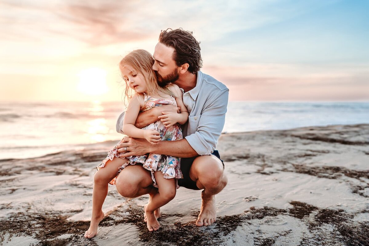 San Diego Family Photographer captures father hugging child and laughing together