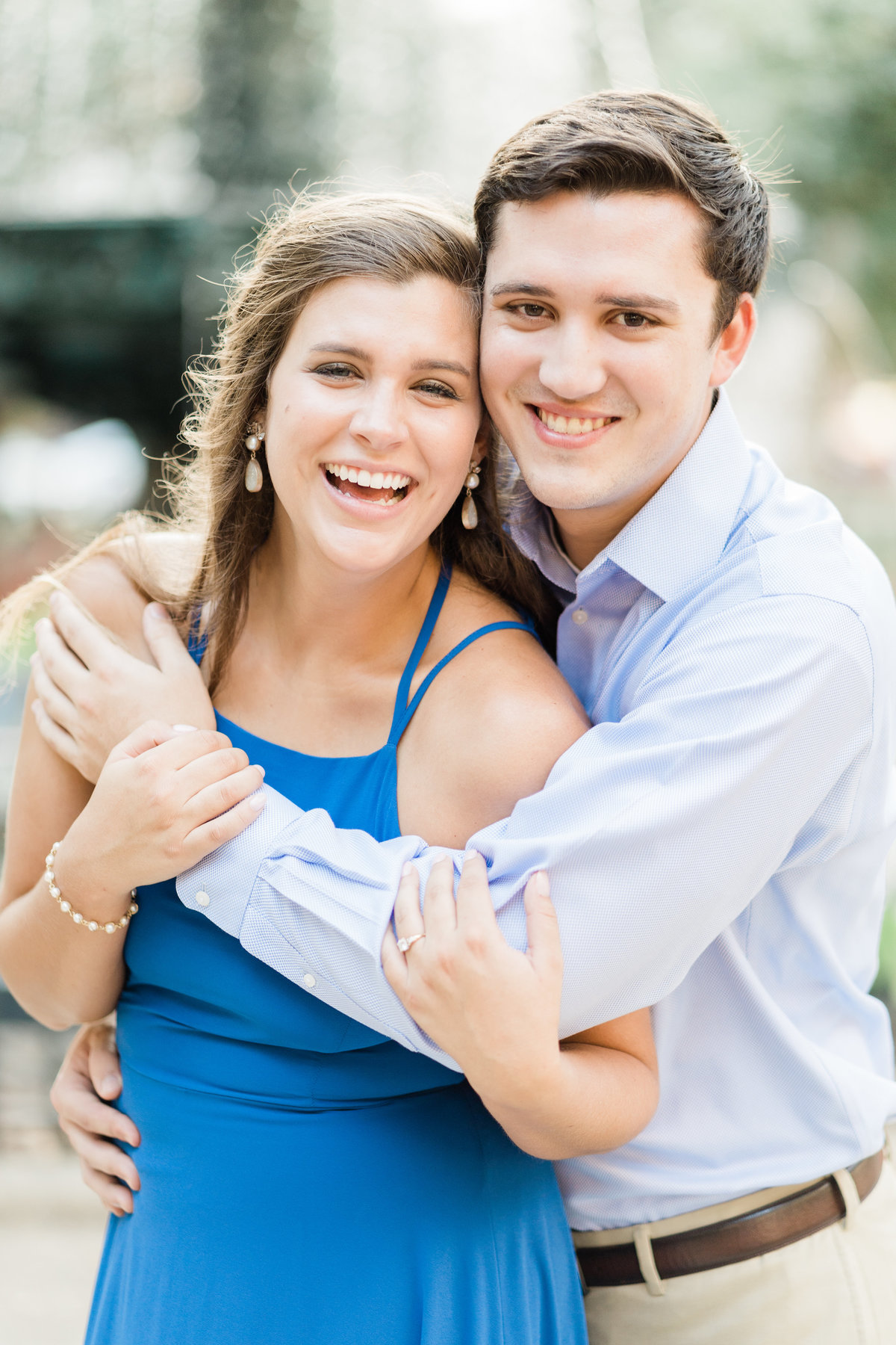 Couple smiling during engagement photoshoot