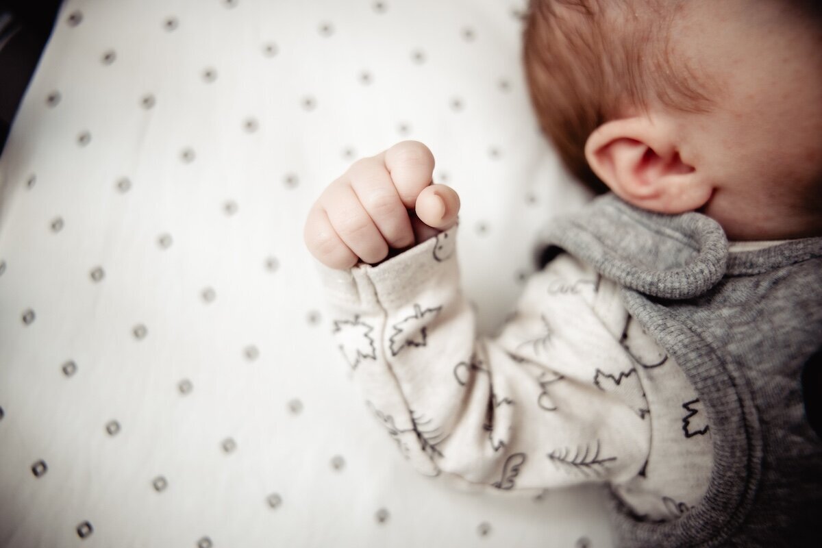 a closeup of a newborn baby girl's fist