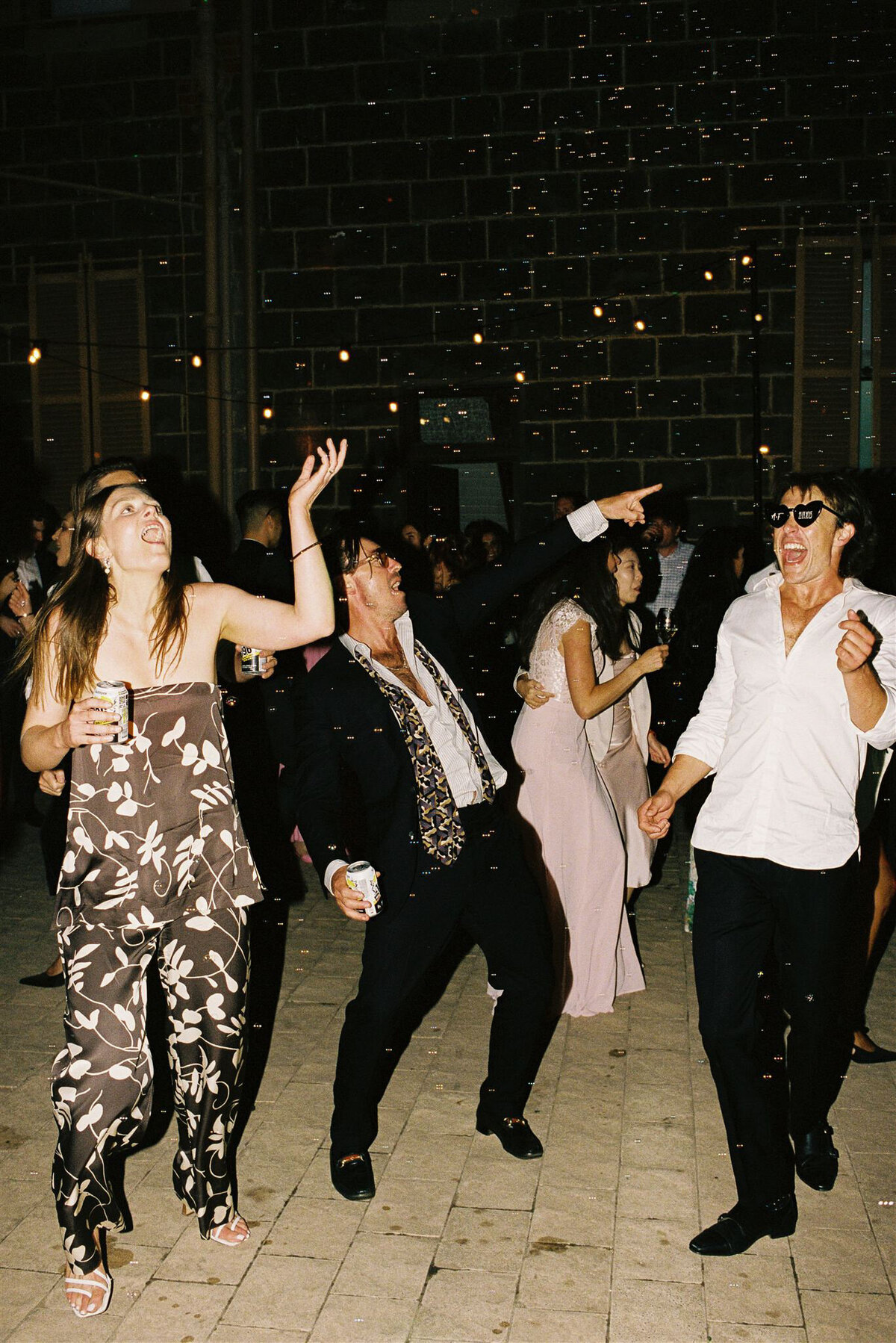 werribee-mansion-wedding-guests-dancing-35mm-1