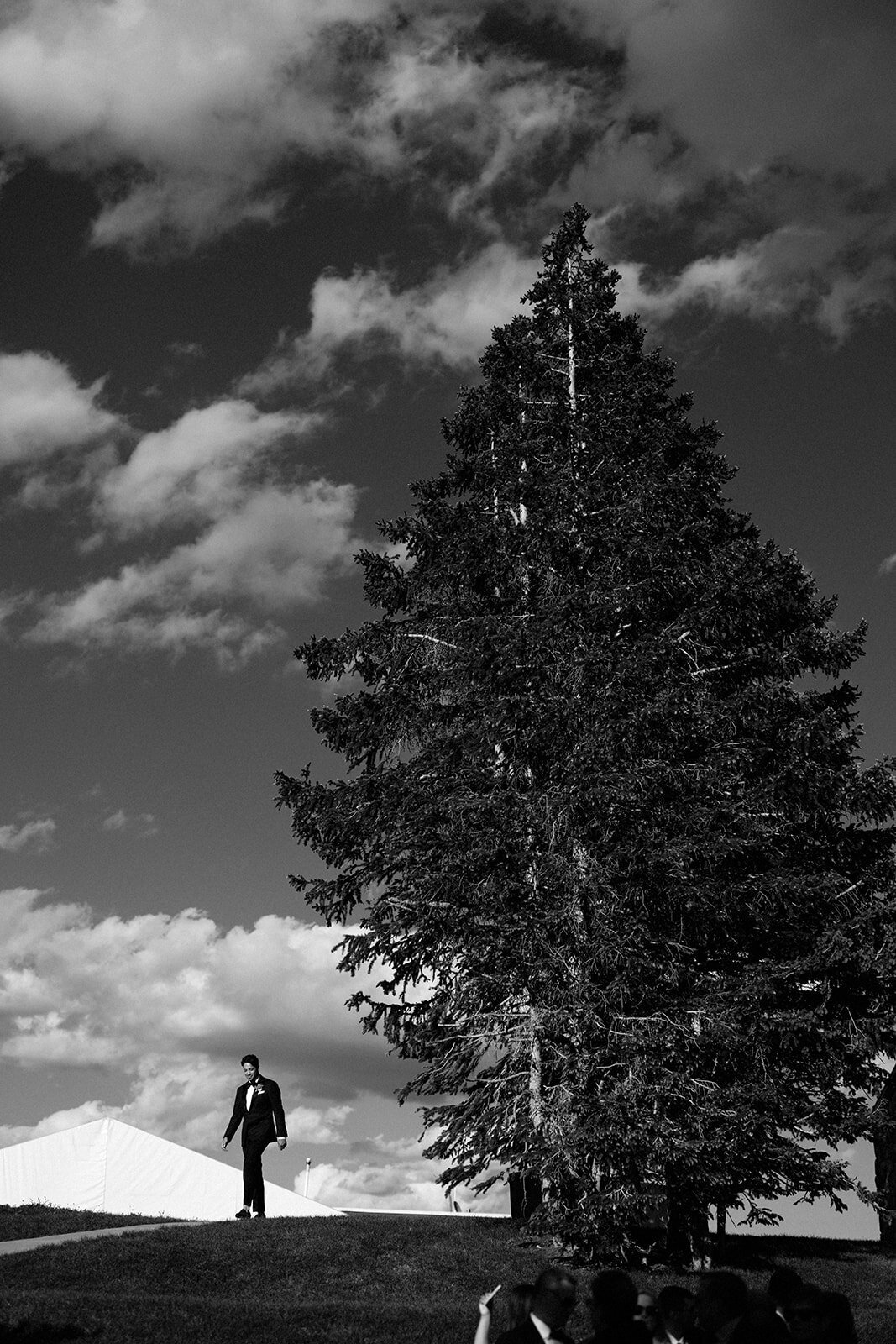 groom-walking-in-ceremony-black-white-aspen-HBICWeddings