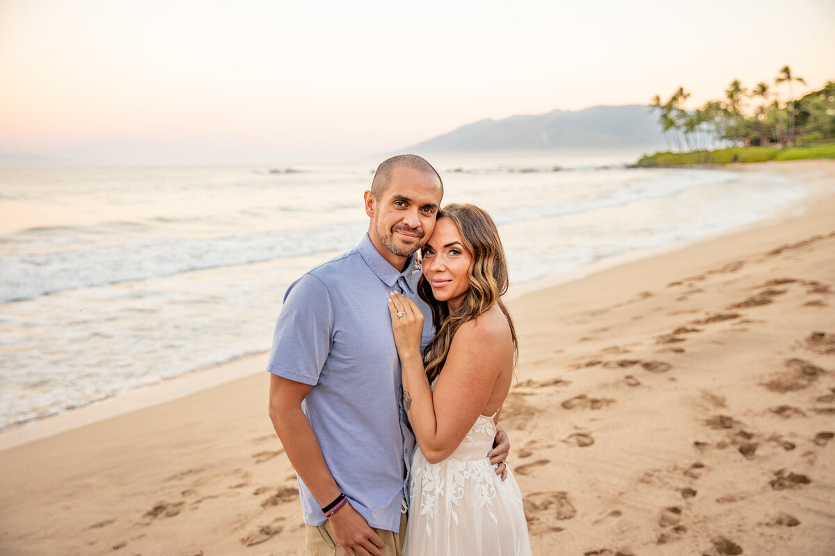 Maui Family Photographers capture couple hugging during beach family photos