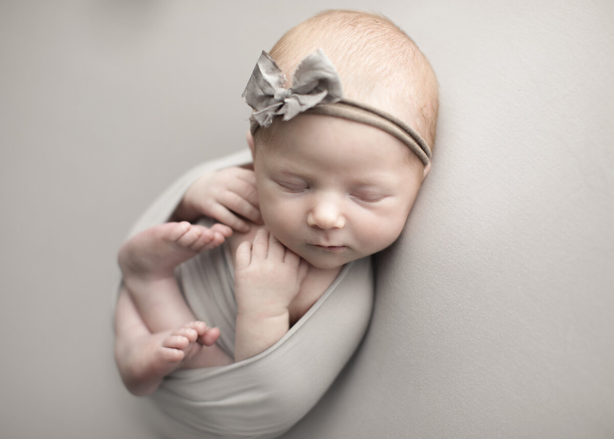 neutral themed newborn baby girl pictures in a Denver Colorado photography studio