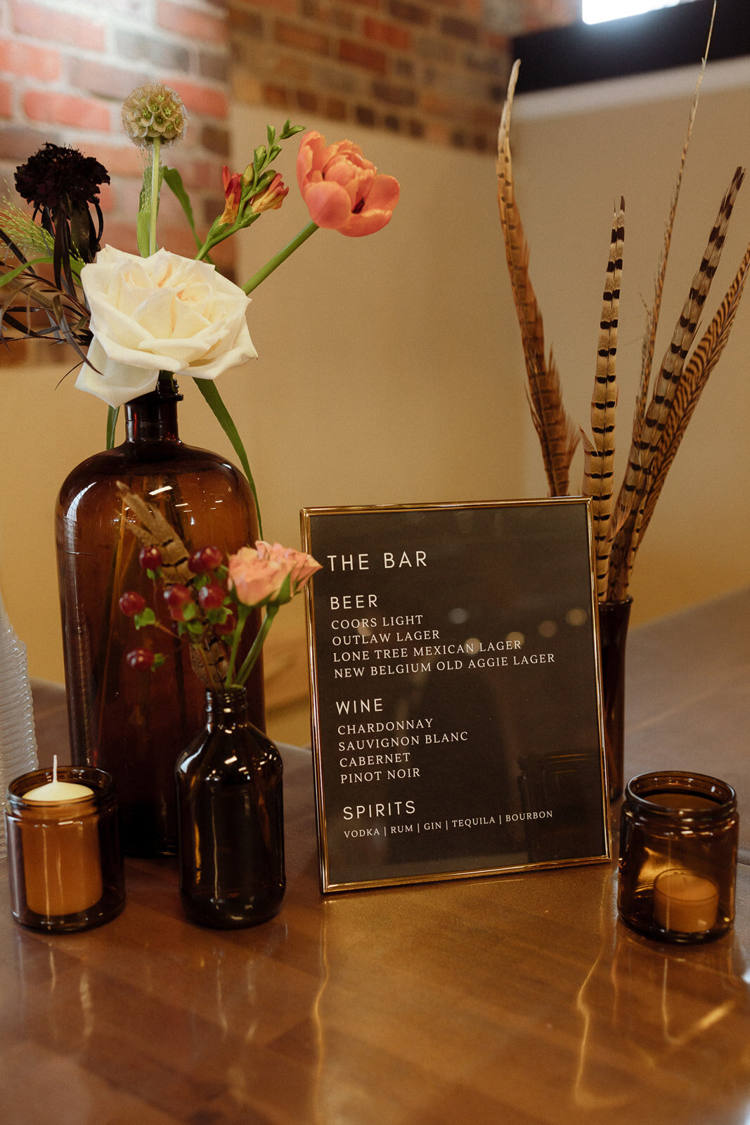 Warm fall bar decorations at a wedding reception at Upper Larimer.