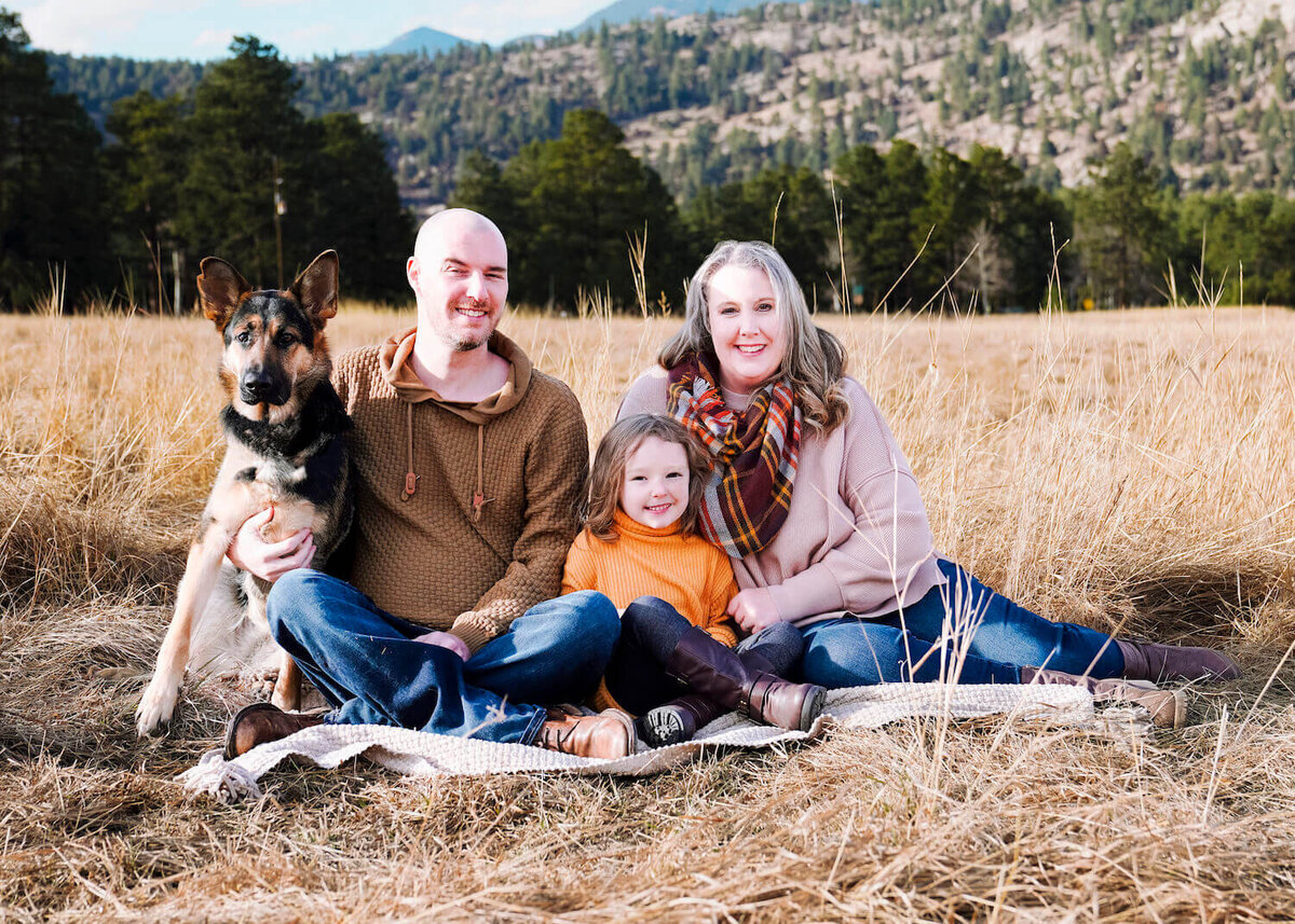 family photography denver co - parents with child and dog in field