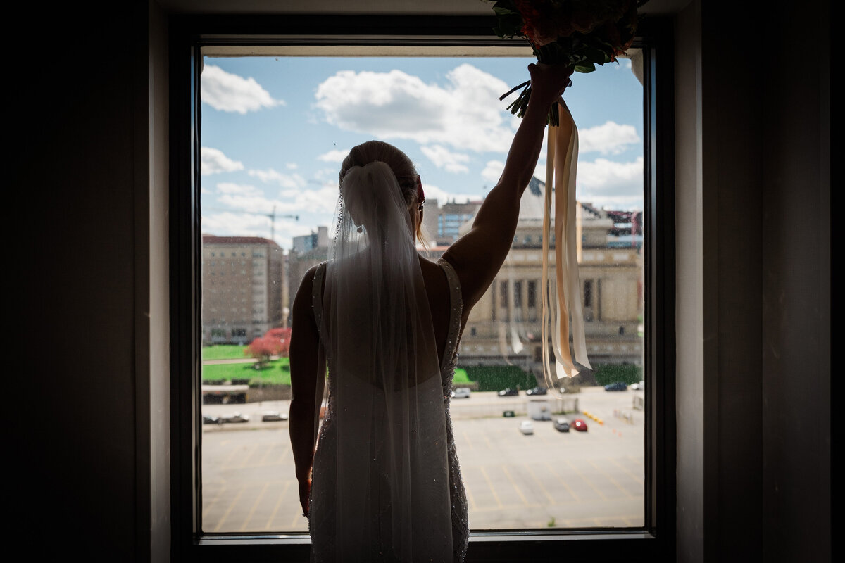 bride cheering for her wedding at soldiers and sailors