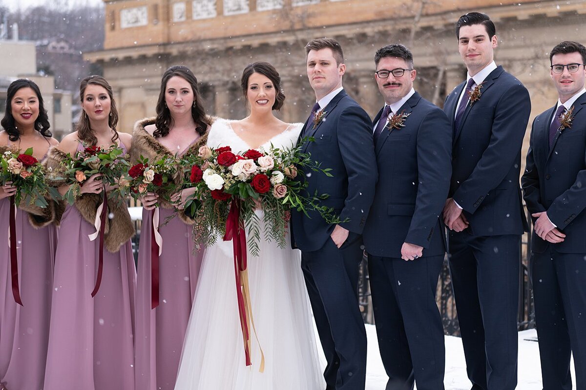 Bride and Groom with Bridal Party on a snowy rooftop at University Club in Pittsburgh, PA