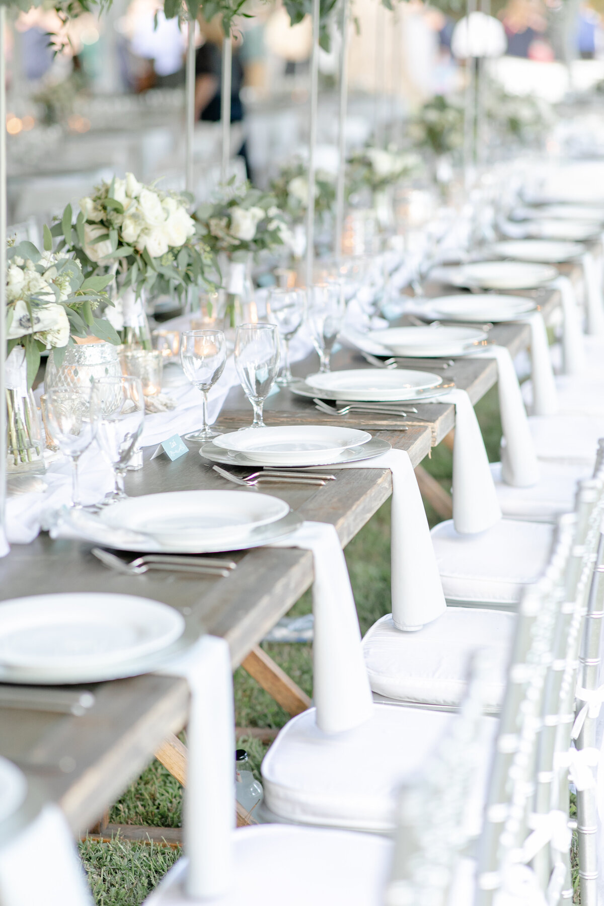 Head table at a tented wedding reception.