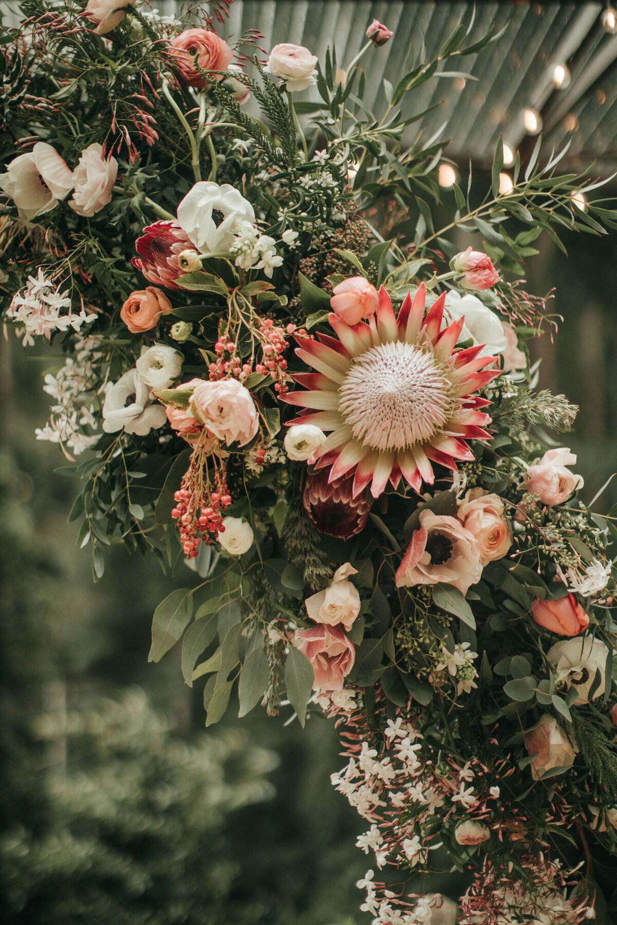 Wedding ceremony floral arrangement with protea flowers