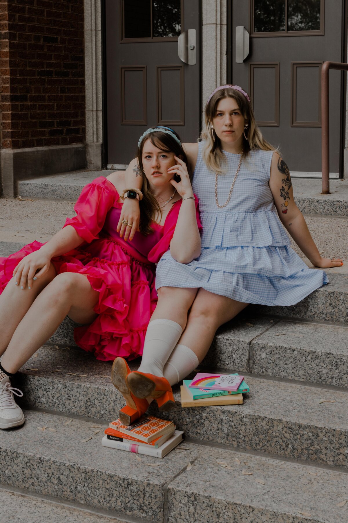 girls-like-us-podcast-show-sitting-infront-of-school