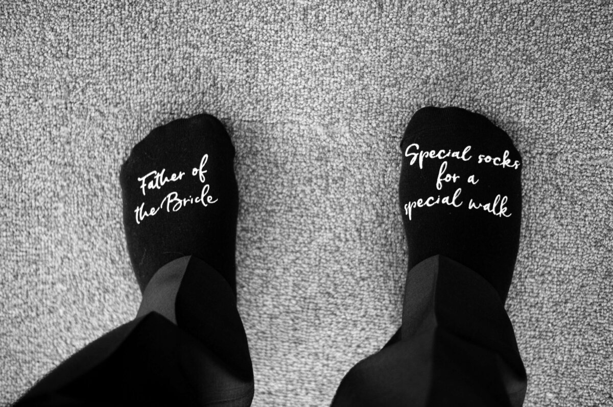 Socks with father of the bride written on them