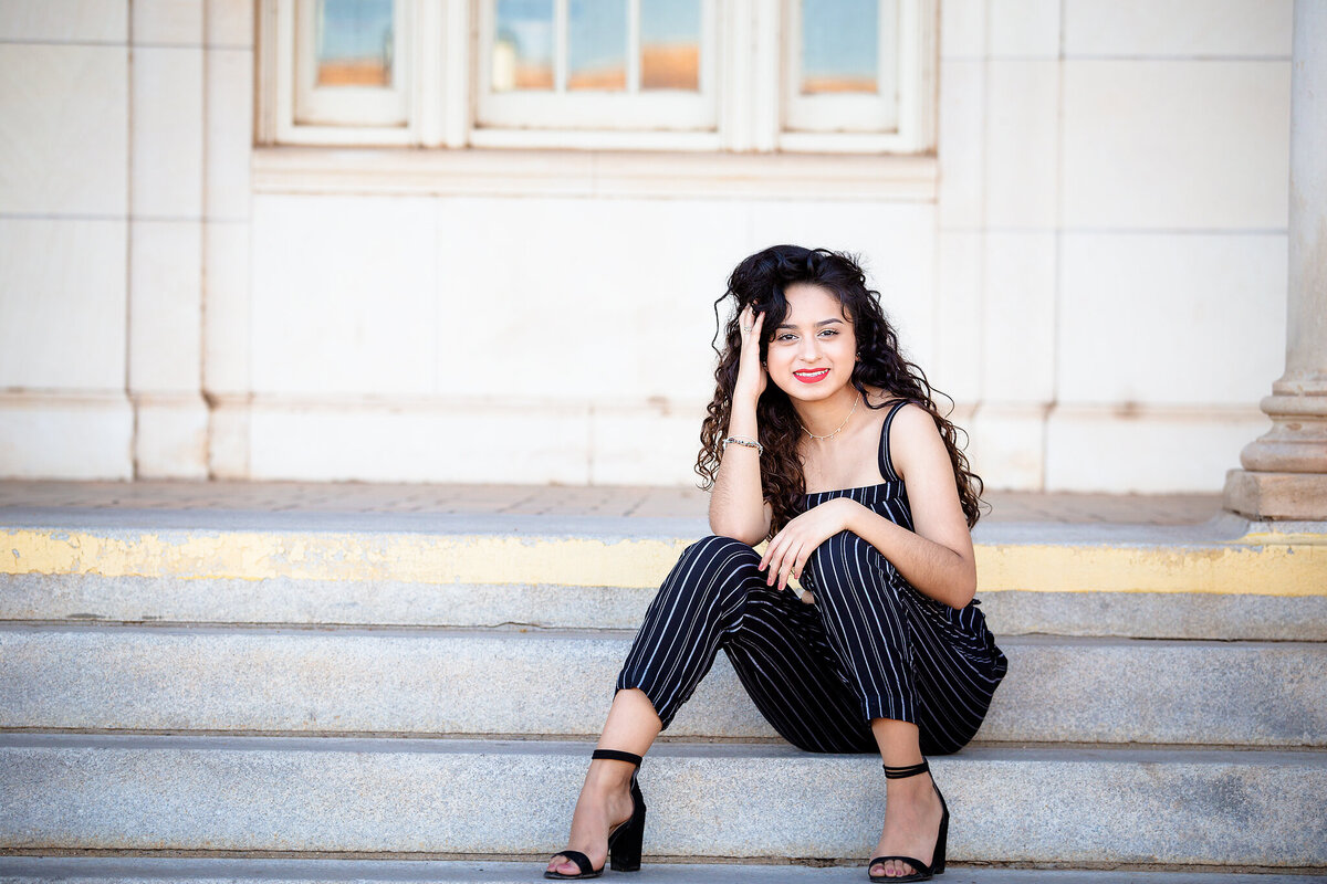 senior girl sitting on steps