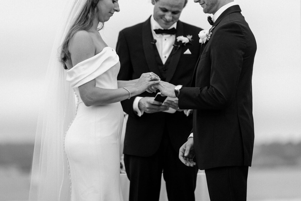 bride and groom exchanging rings