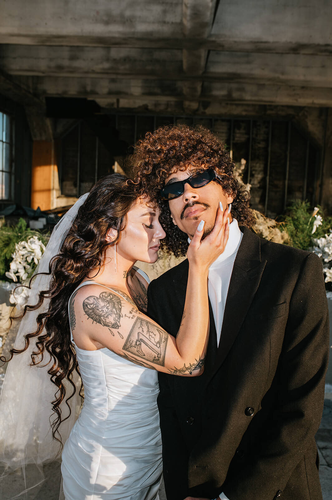 Bride-holds-grooms-face