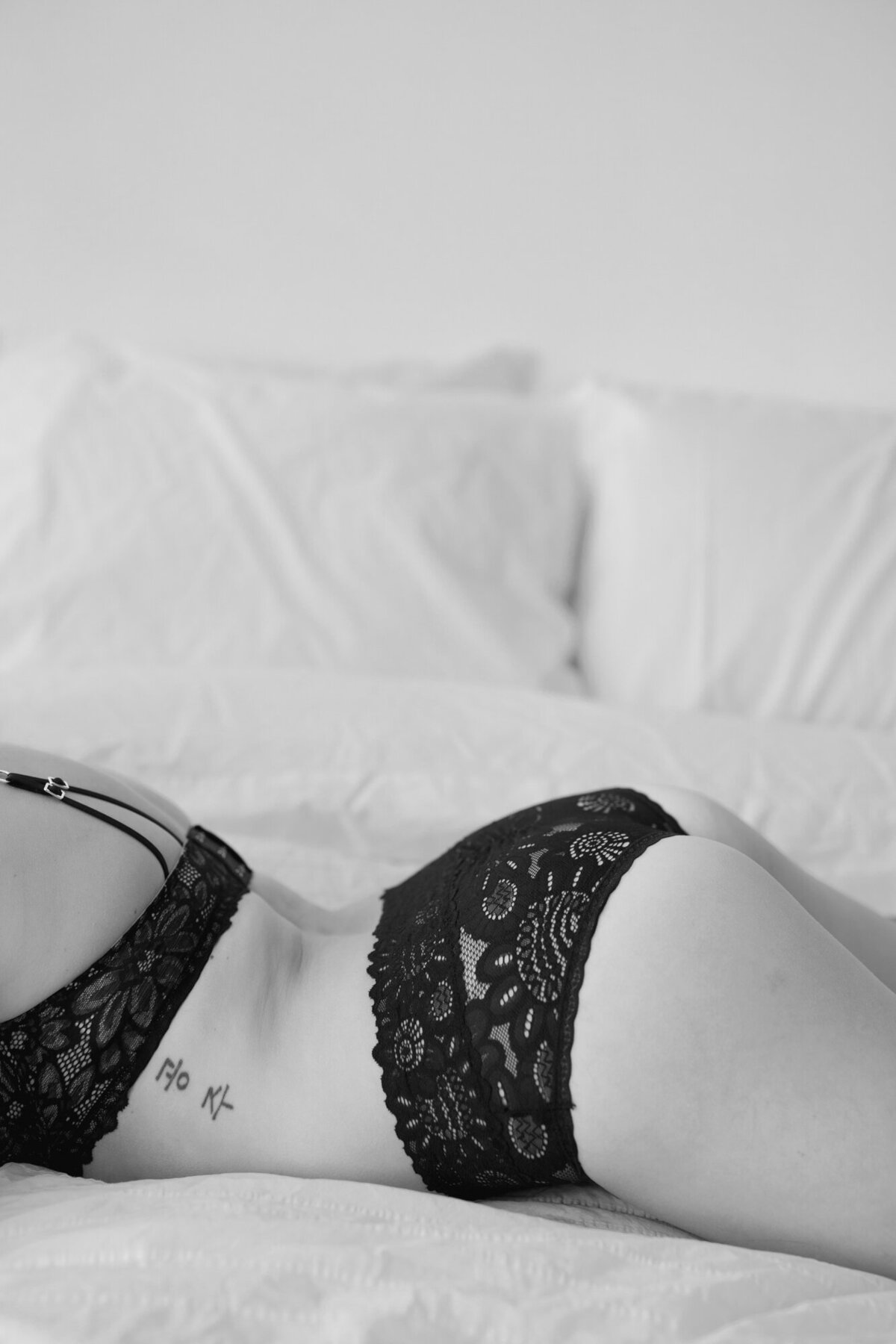 A black and white boudoir detail photo