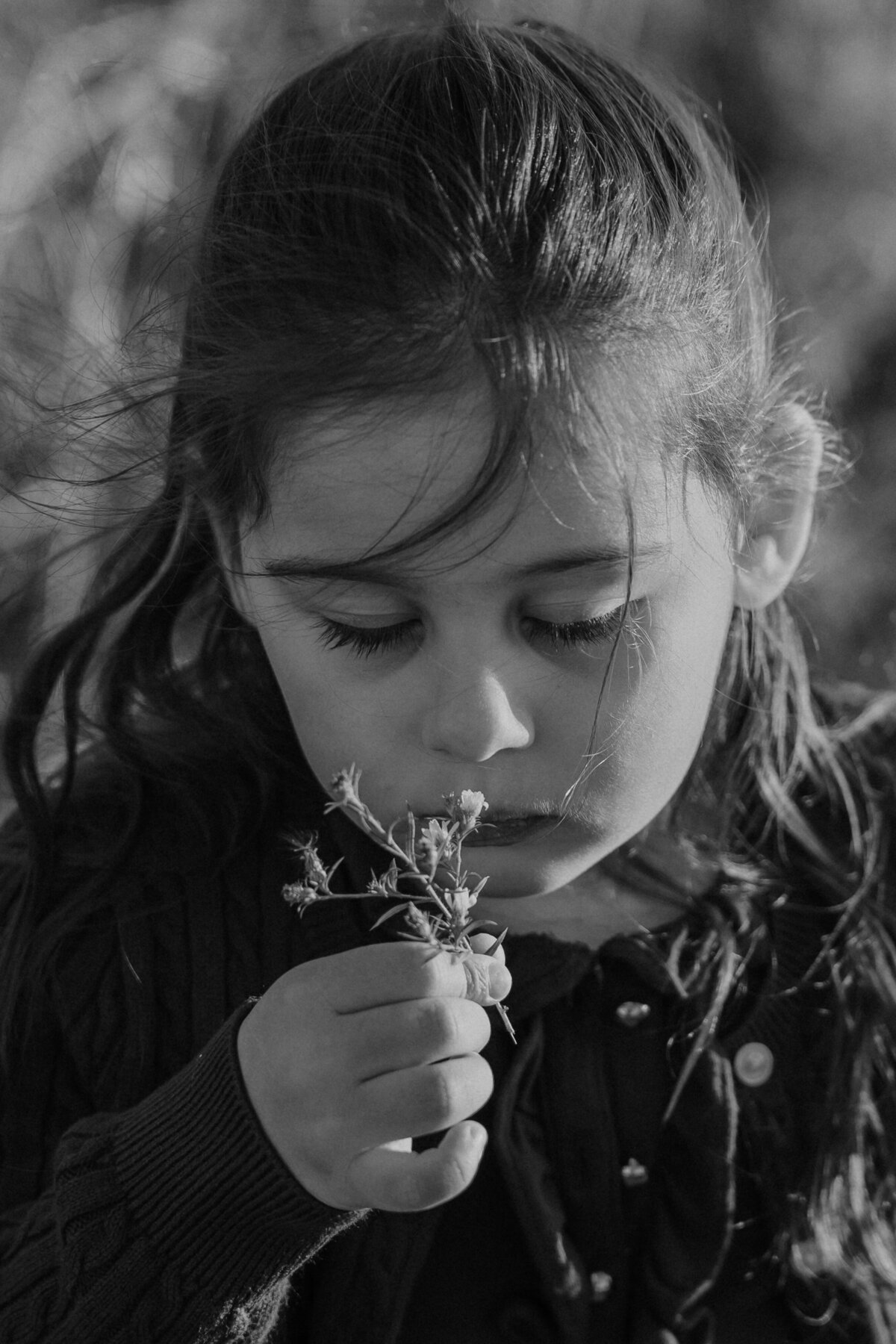 Girl smelling the flowers