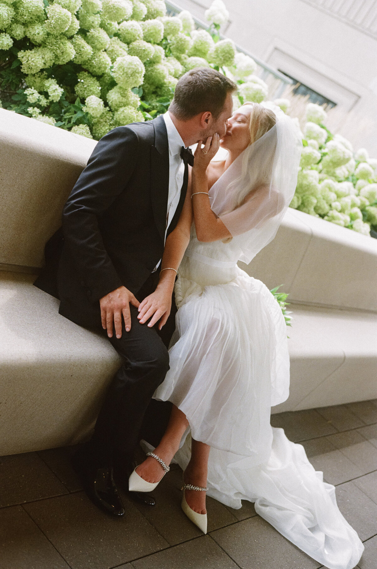 Sophisticated editorial wedding photography at Old Post Office Chicago featuring Lauren Alatriste's fashion forward approach to ceremony coverage, creating luxury wedding imagery that balances architectural beauty with magazine-worthy aesthetics