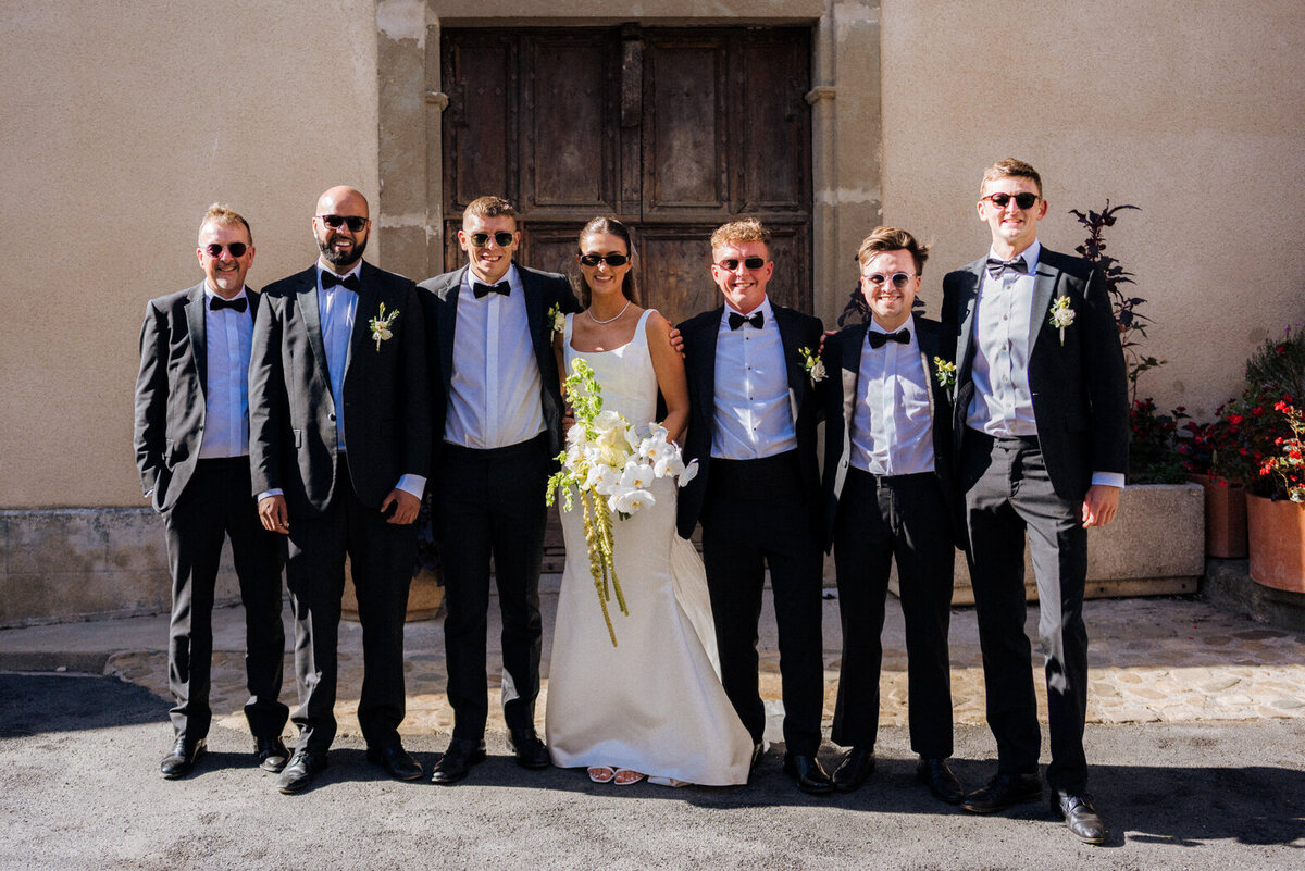 bride-church-exit-white-orchid-wedding-bouquet-france10