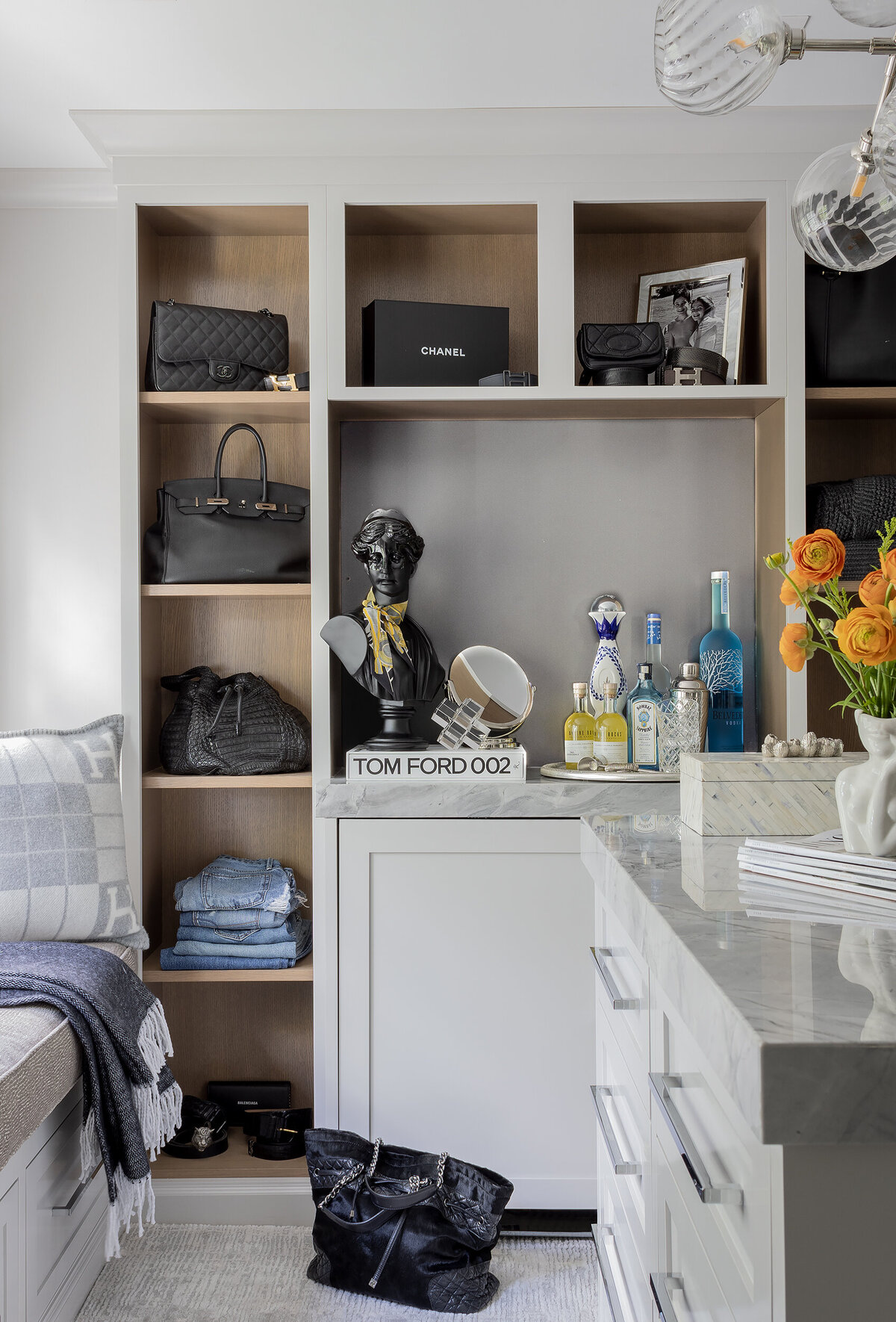 Luxury custom closet in Wellesley featuring built-in shelving and elegant storage design