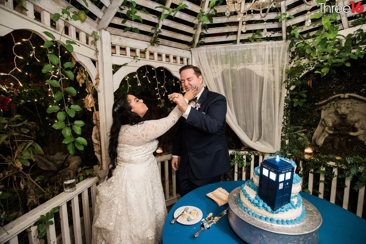 Bride and Groom smash cake into each other's face