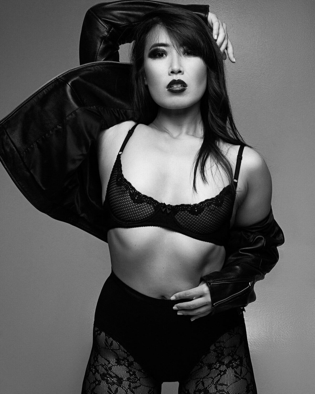 Model in dramatic winged eyeliner and sculpted cheekbones – editorial glam makeup by a Fairfield County and NYC artist.