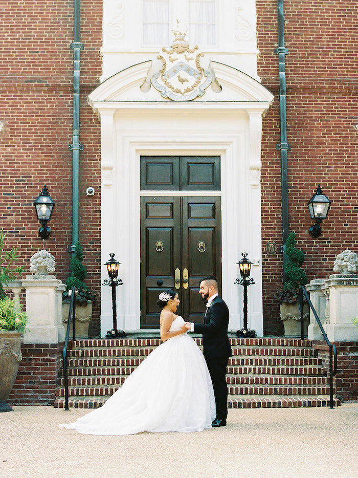 Bride and groom outside a church during their first look