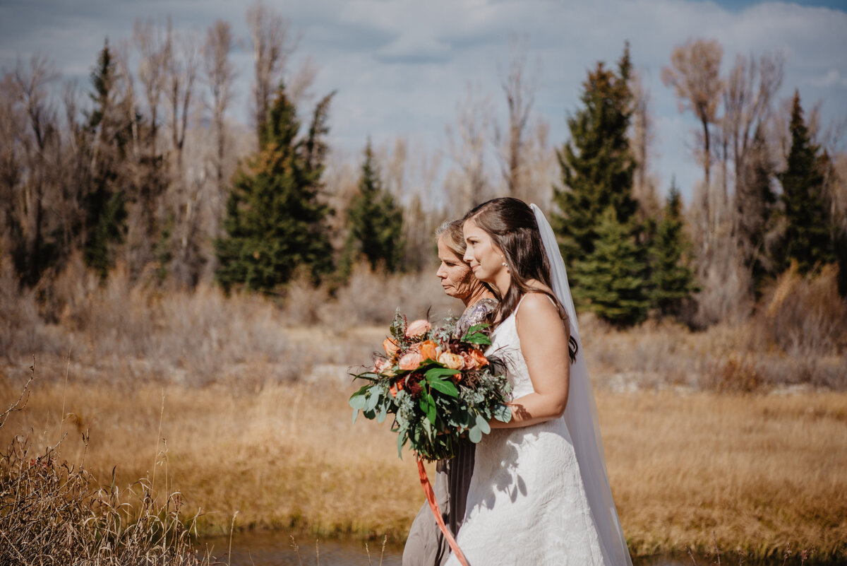 Photographers Jackson Hole capture bride walking to groom
