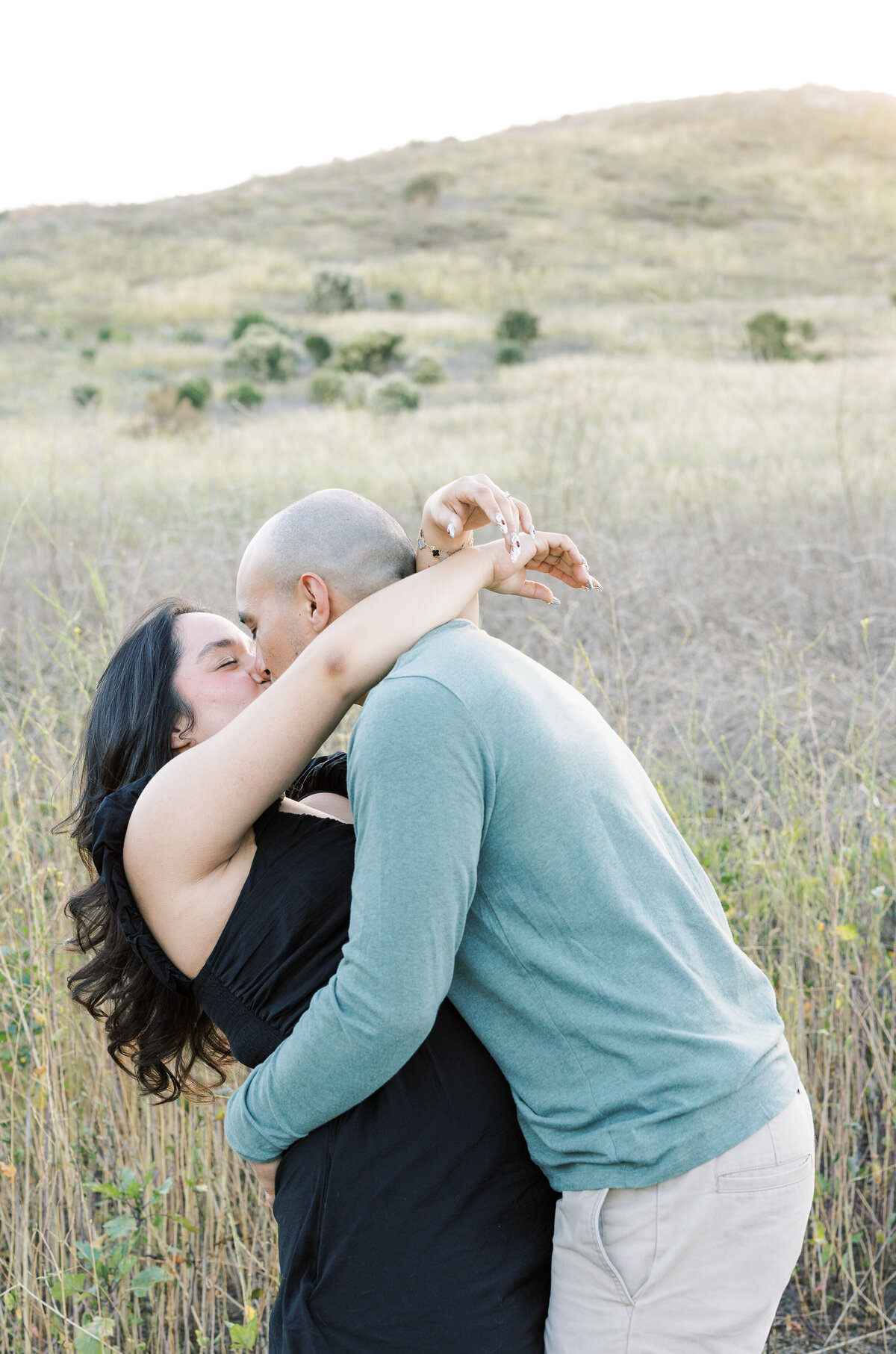 romantic dancing couple in open field