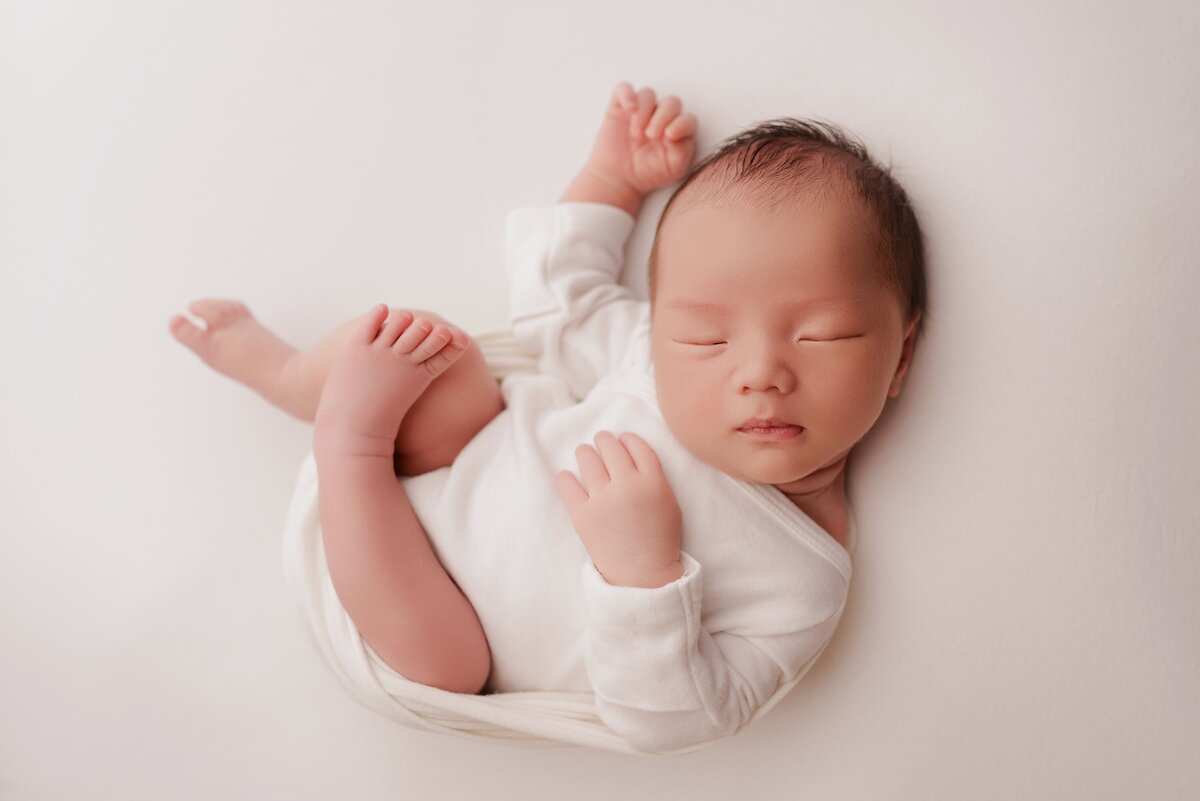 Beautiful newborn portraits in Elk Grove and Sacramento, capturing your baby's precious moments with simple elegance. Book your session today
