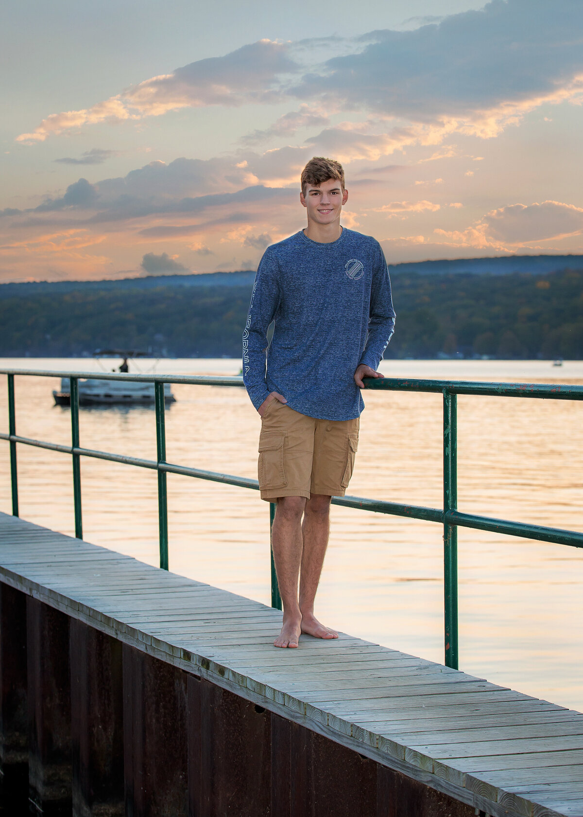 Boy senior pictures at sunset on Keuka Lake in Penn Yan, NY